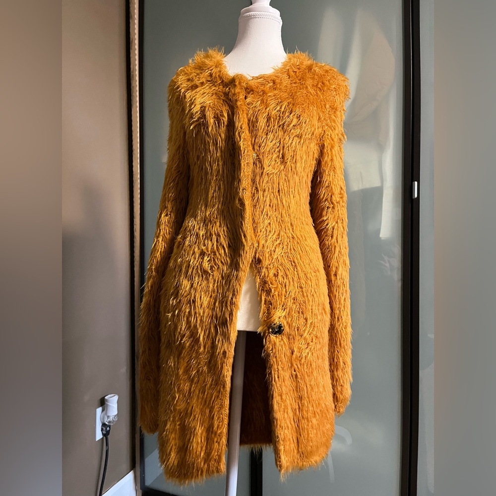 Very soft orange blazer 
Size small made